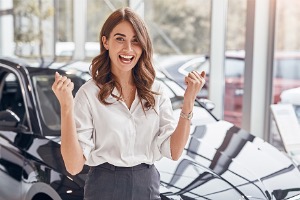 Woman excited in a dealership